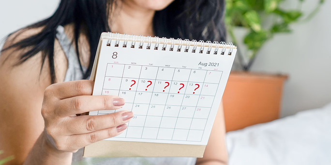 Woman wondering "Can you get pregnant on your period?"