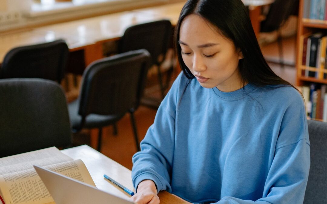 young female college student studying in college